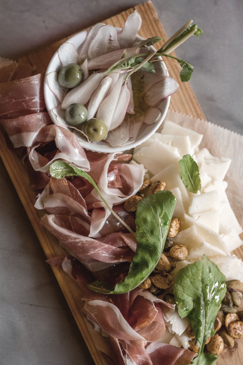 Charcuterie board with cured meats